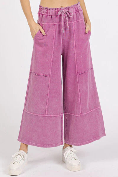 Woman wearing wide-leg pants with a string