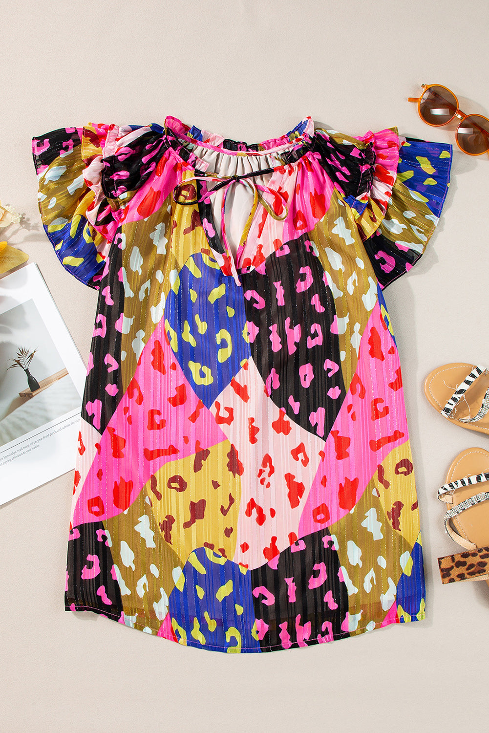 Ruffled Printed Tie Neck Cap Sleeve Blouse