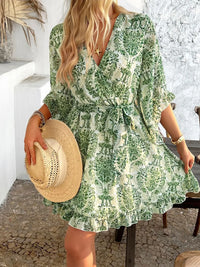 Devine Printed Surplice Ruffled 3/4 Sleeve Mini Dress